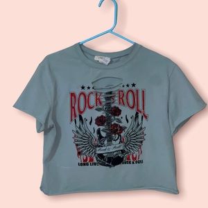 A crop top. Ripped from the center. Design  is Rock